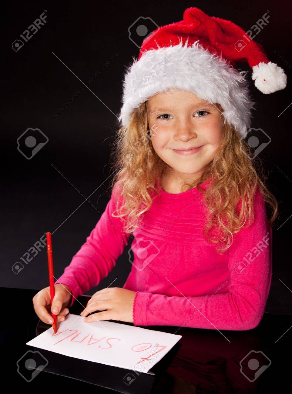 Child Writing A Letter To Santa Claus. Little Girl Stock Photo