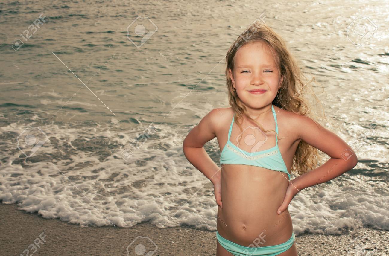 Vacations. Girl on the beach. Sunset. - 100349122 Vacations. Girl on the beach. Sunset. - 100349122
