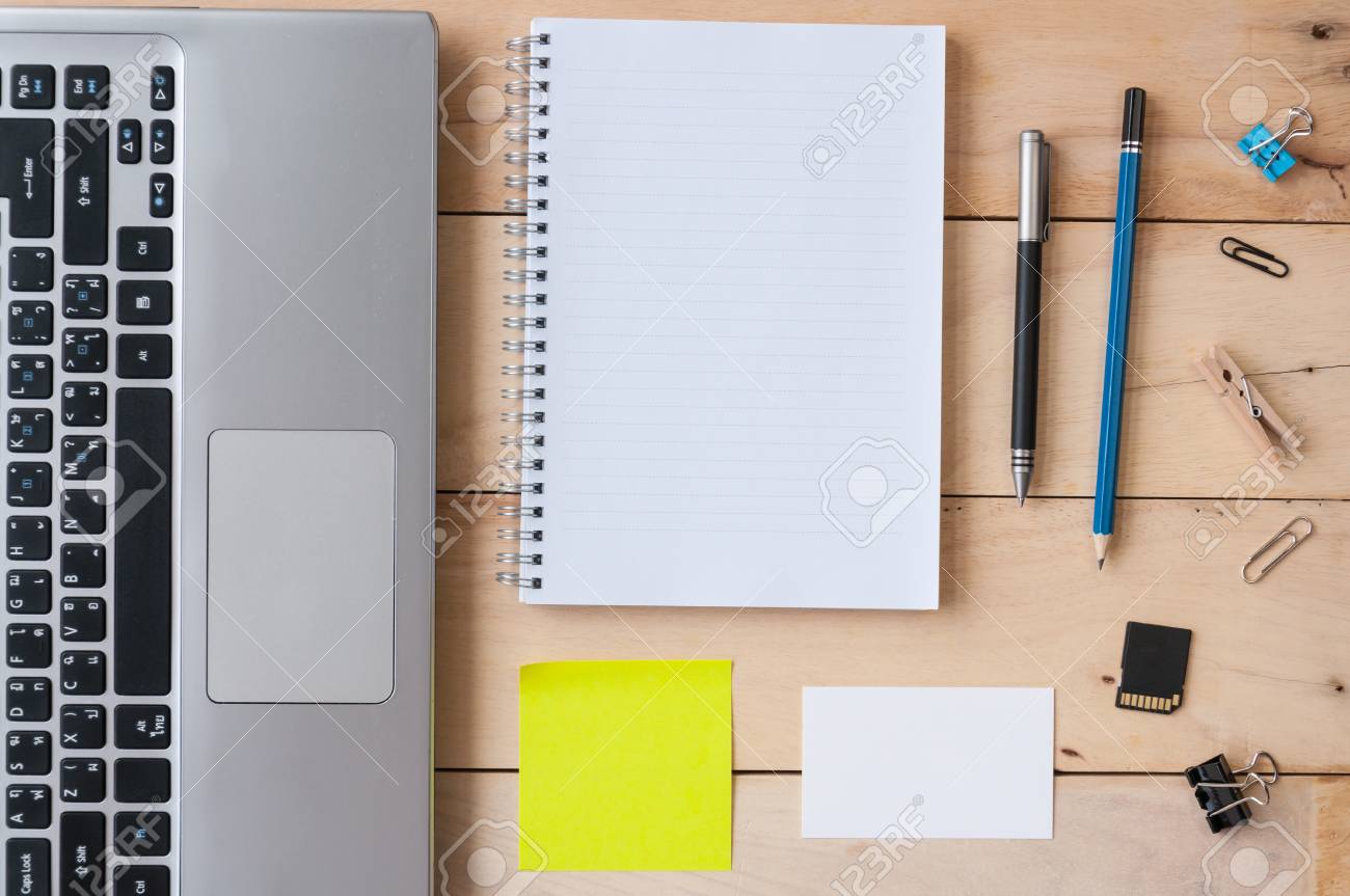 Notebook With Laptop, Paper Clips, Pen And Pencil On Wooden Table, Top View  Shot Stock Photo, Picture and Royalty Free Image. Image 61238240., image size:1300x863