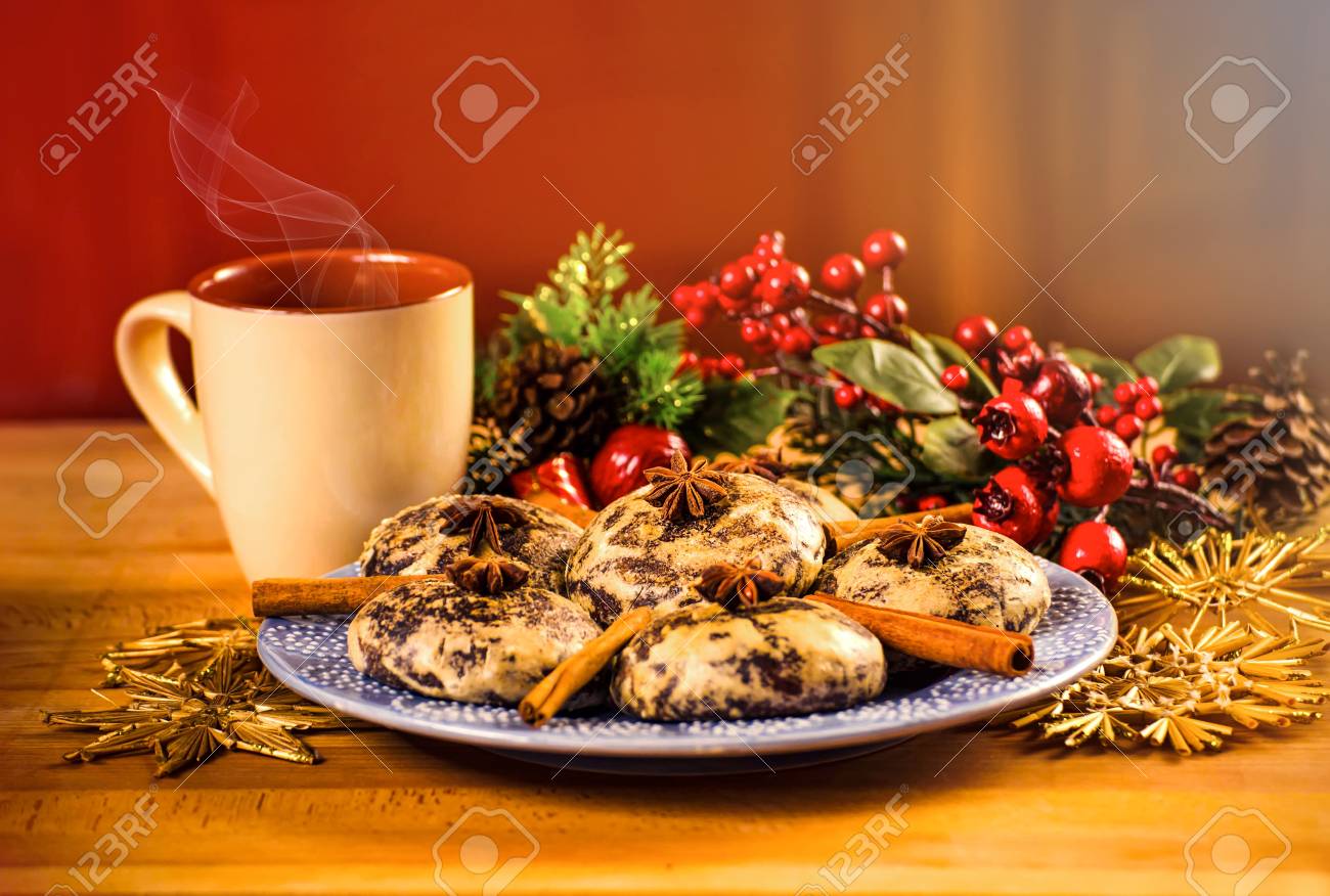 mug with hot drink and christmas cookies background with a cup of christmas cookies background