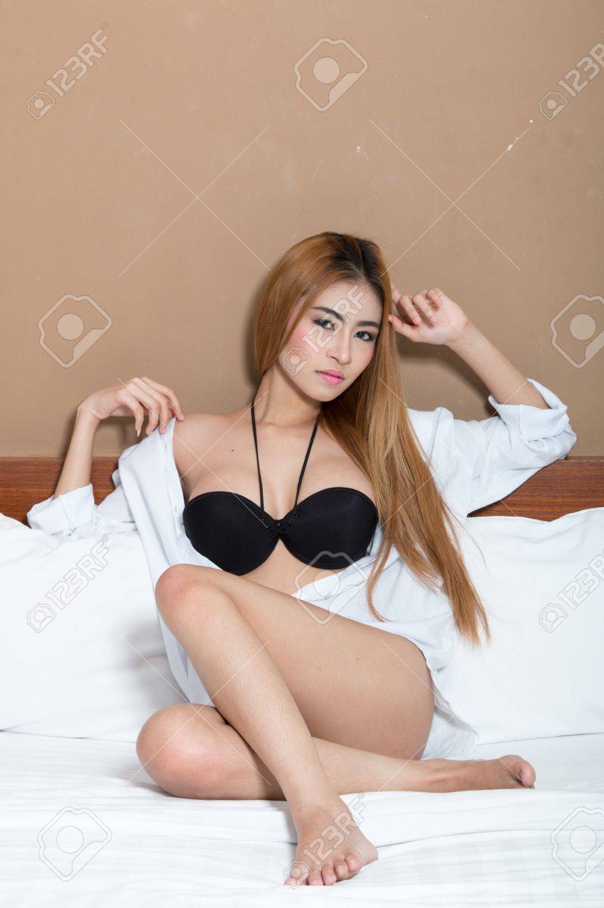 A Very Sexy Asian Girl Wearing Lingerie, Posing Very Sexy. Фотография,  картинки, изображения и сток-фотография без роялти. Image 74702460