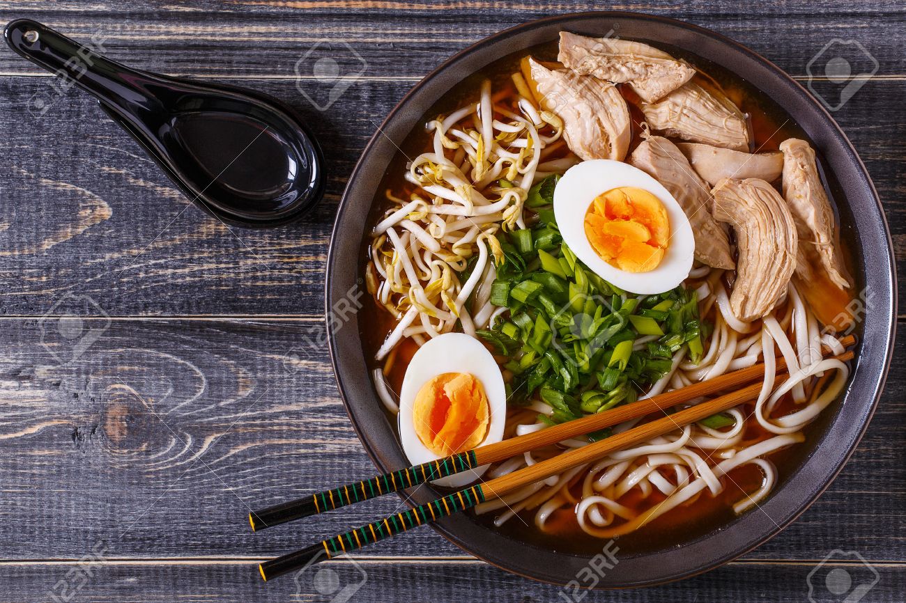 Japanese ramen soup with chicken, egg, chives and sprout on dark wooden background. - 53701408 Japanese ramen soup with chicken, egg, chives and sprout on dark wooden background. - 53701408