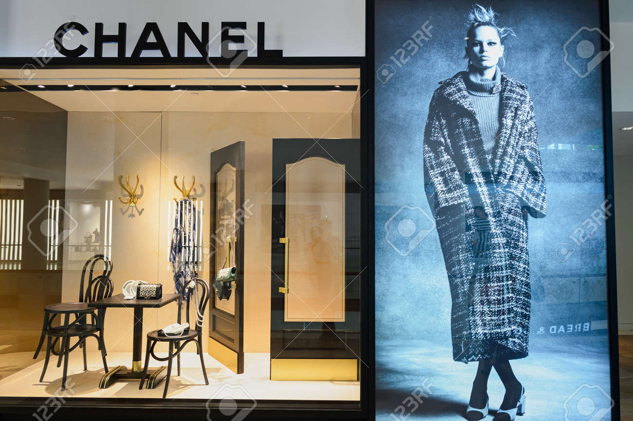 SINGAPORE - NOVEMBER 08, 2015: Shop Window Of Chanel Store. Chanel . Is A High Fashion House That Specializes In Haute Couture And Ready-to-wear Clothes, Luxury Goods And Fashion Accessories Stock Photo, SINGAPORE - NOVEMBER 08, 2015: Shop Window Of Chanel Store. Chanel . Is A High Fashion House That Specializes In Haute Couture And Ready-to-wear Clothes, Luxury Goods And Fashion Accessories Stock Photo,