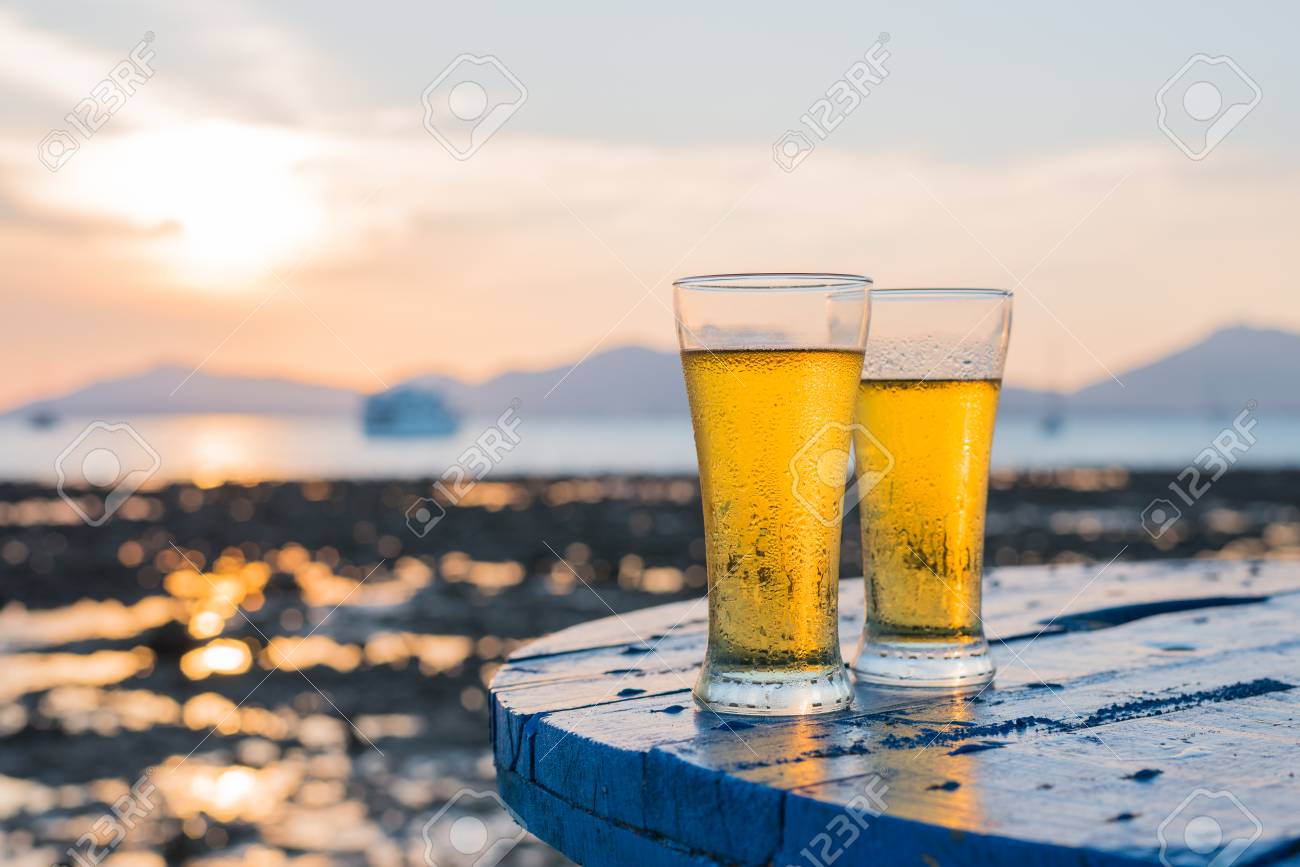 Glass Of Beer On A Beach At Sunset Stock Photo Picture And Royalty Free Image Image 71406613