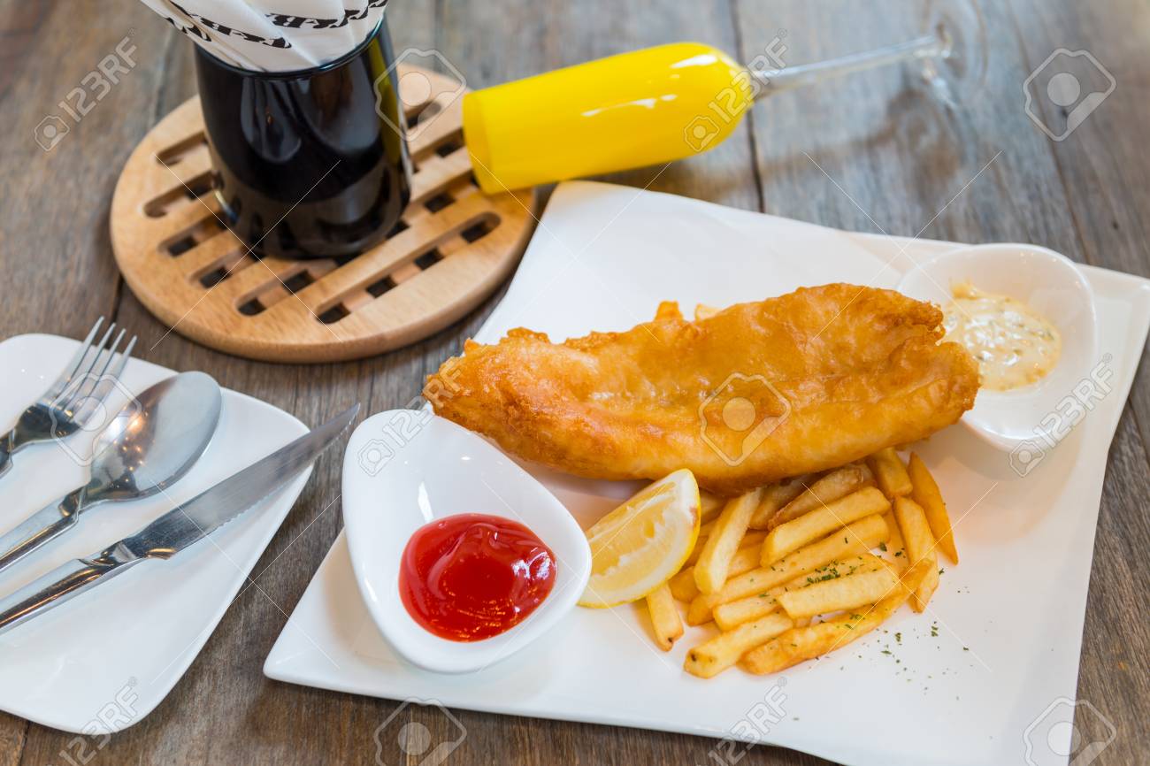 Traditional English Food Fish And Chips With Ketchup And Lemon Stock Photo Picture And Royalty Free Image Image 77883671
