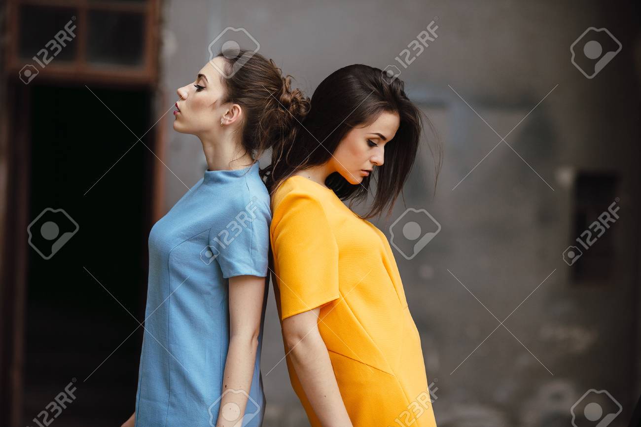 Two young beautiful girls posing against the backdrop of an abandoned building - 43070851 Two young beautiful girls posing against the backdrop of an abandoned building - 43070851