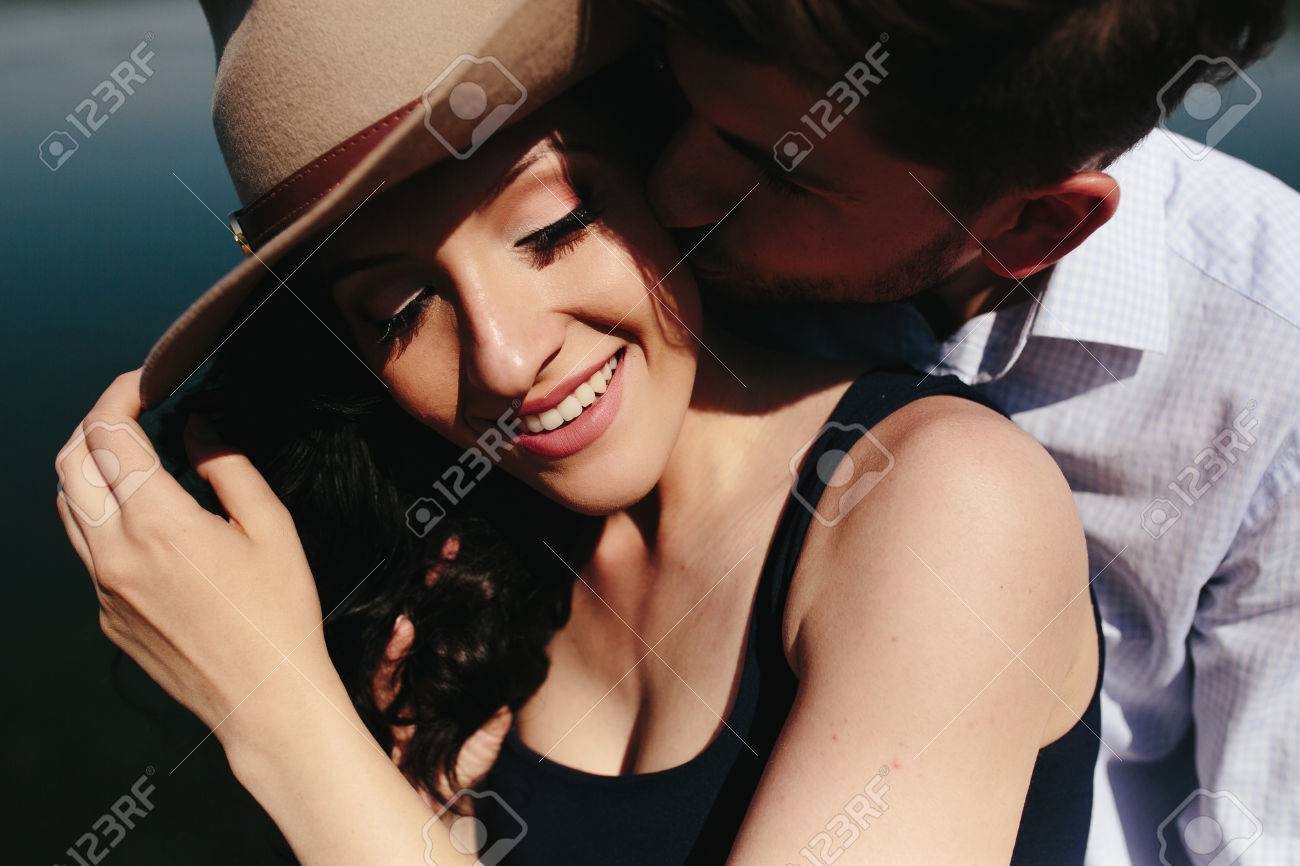 beautiful young couple spends time on the wooden pier on the lake - 43934101 beautiful young couple spends time on the wooden pier on the lake - 43934101