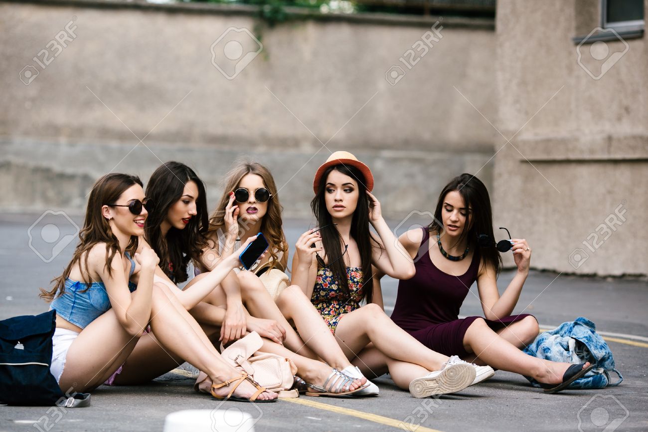 Five beautiful young girls relaxing in the city - 44144166 Five beautiful young girls relaxing in the city - 44144166