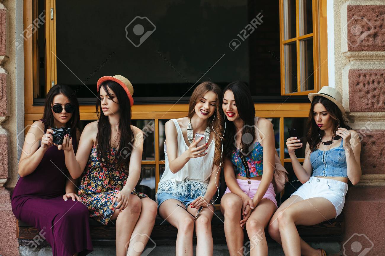 Five beautiful young girls relaxing in the city - 54492808 Five beautiful young girls relaxing in the city - 54492808