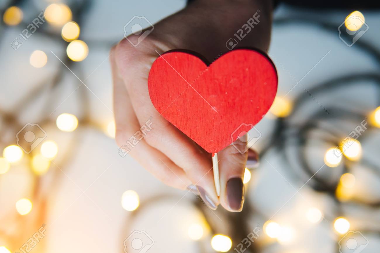 girl holding a red heart in the hands - 71508328 girl holding a red heart in the hands - 71508328