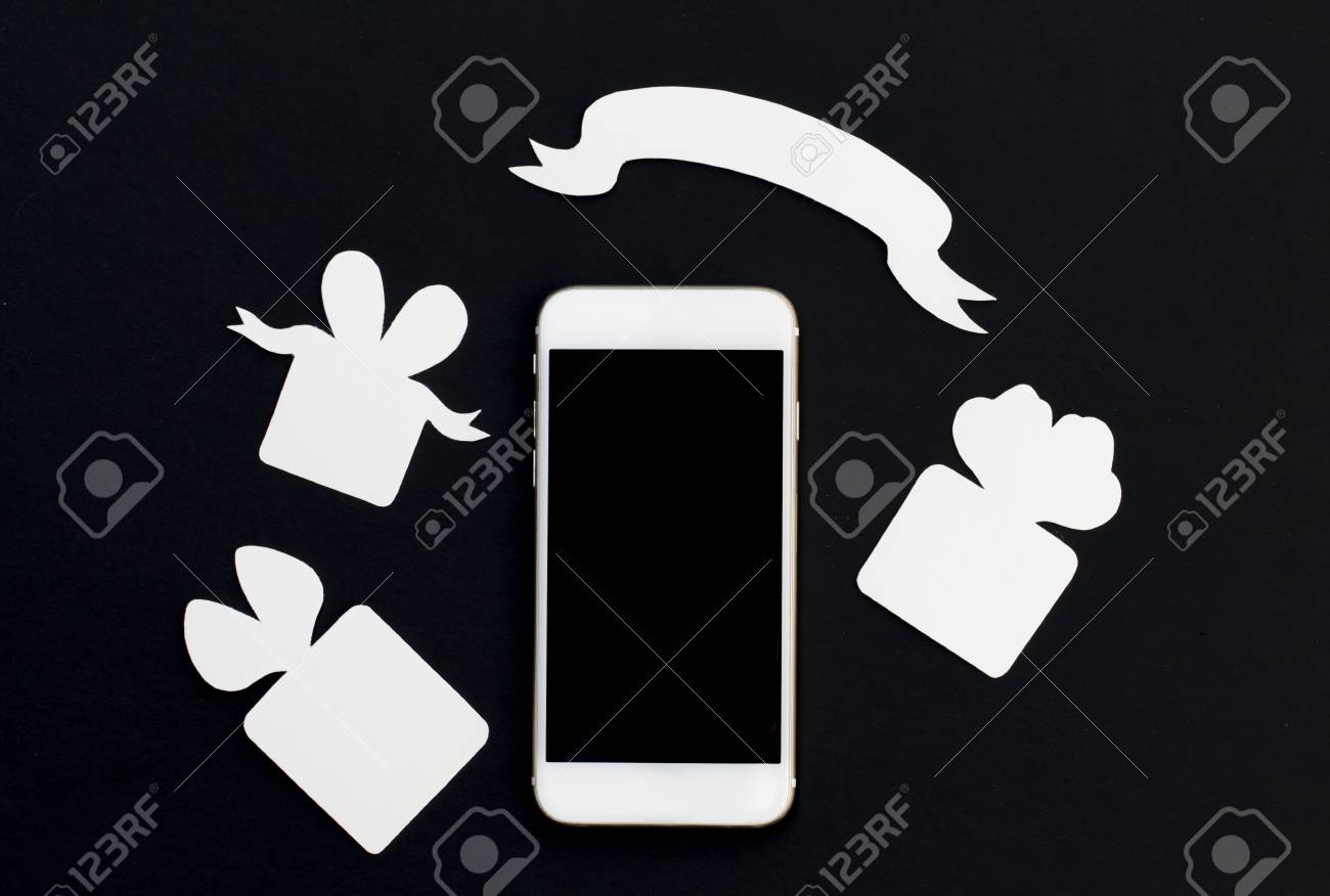 white phone with gift boxes and blank ribbon banner on black stock