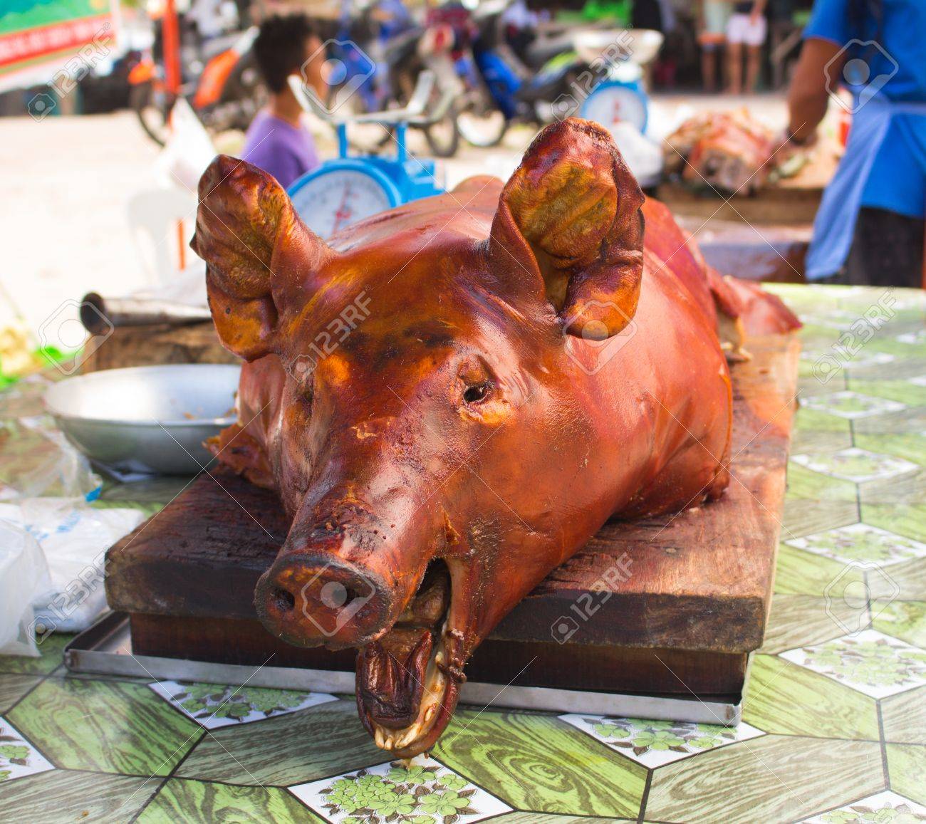 Roasted Pig S Head On Market S Table In Sunlight Tasty Meat Stock Photo Picture And Royalty Free Image Image 75823440