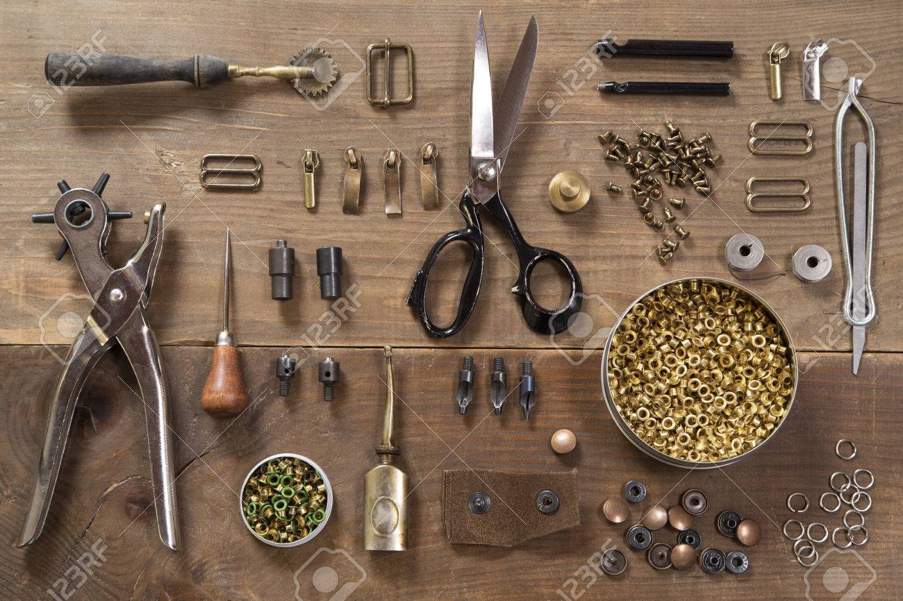 Leather craft tools on a wooden background - 38884541 Leather craft tools on a wooden background - 38884541