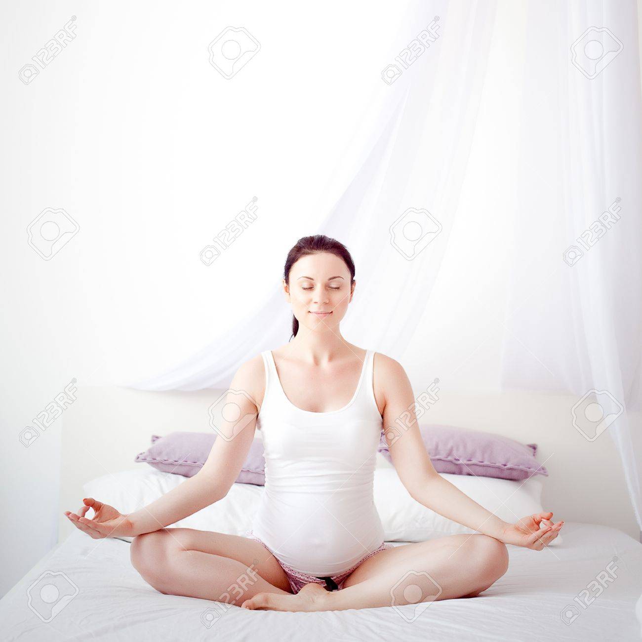 young pregnant woman in the bedroom - 21611992 young pregnant woman in the bedroom - 21611992