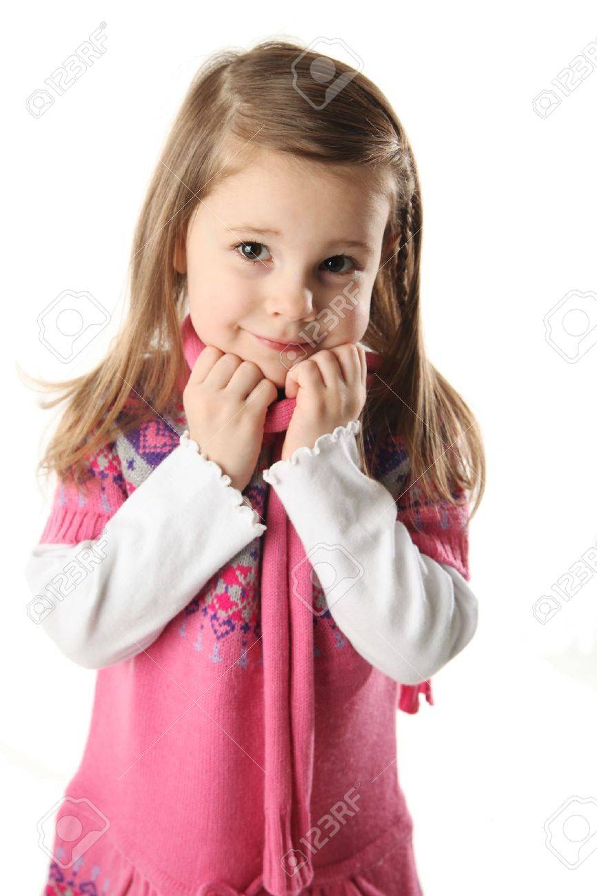 Portrait of a smilng adorable preschool girl wearing a knit pink dress and scarf - 8710212 Portrait of a smilng adorable preschool girl wearing a knit pink dress and scarf - 8710212