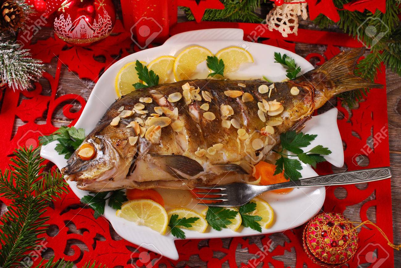 roasted whole carp stuffed with vegetables and almonds for christmas-top view - 34559163 roasted whole carp stuffed with vegetables and almonds for christmas-top view - 34559163