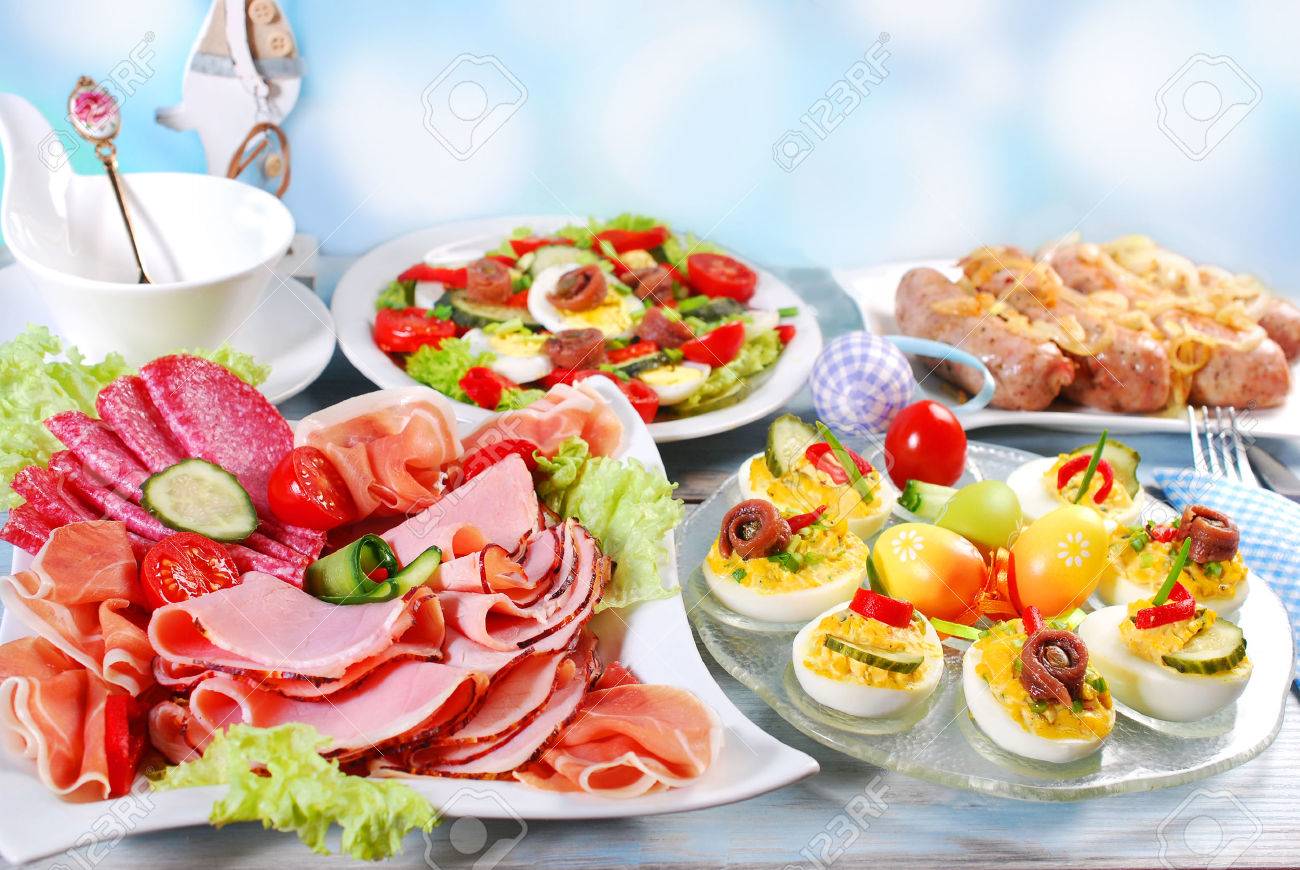 traditional easter breakfast with stuffed eggs,ham and cured meat platter,salad and white sausage with onion - 52549238 traditional easter breakfast with stuffed eggs,ham and cured meat platter,salad and white sausage with onion - 52549238