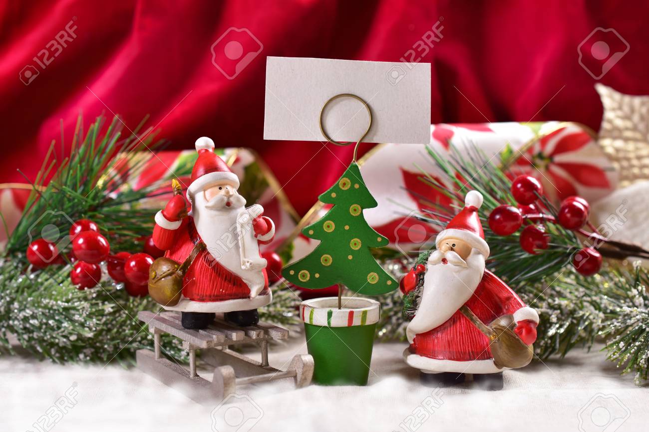 Christmas Decoration With Two Funny Santa Clauses Figurine And Christmas Tree Shape Card Holder For Greetings Christmas Decoration With Two Funny Santa Clauses Figurine And Christmas Tree Shape Card Holder For Greetings