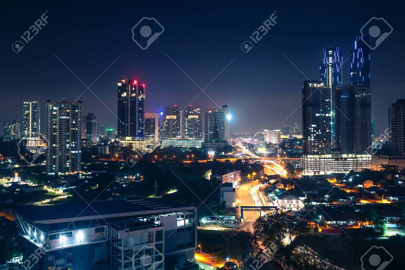 Johor Bahru, Malaysia, at night. Malaysian city with traffic on highway and modern business buildings and hotels in downtown. Scenic urban skyline and cityscape. Aerial view. - 141631341 Johor Bahru, Malaysia, at night. Malaysian city with traffic on highway and modern business buildings and hotels in downtown. Scenic urban skyline and cityscape. Aerial view. - 141631341
