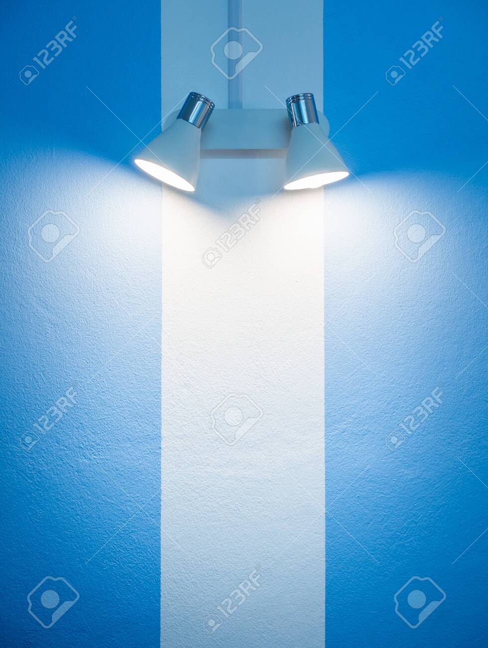 Wall Lamp On White And Blue Striped Wall Background With Copy