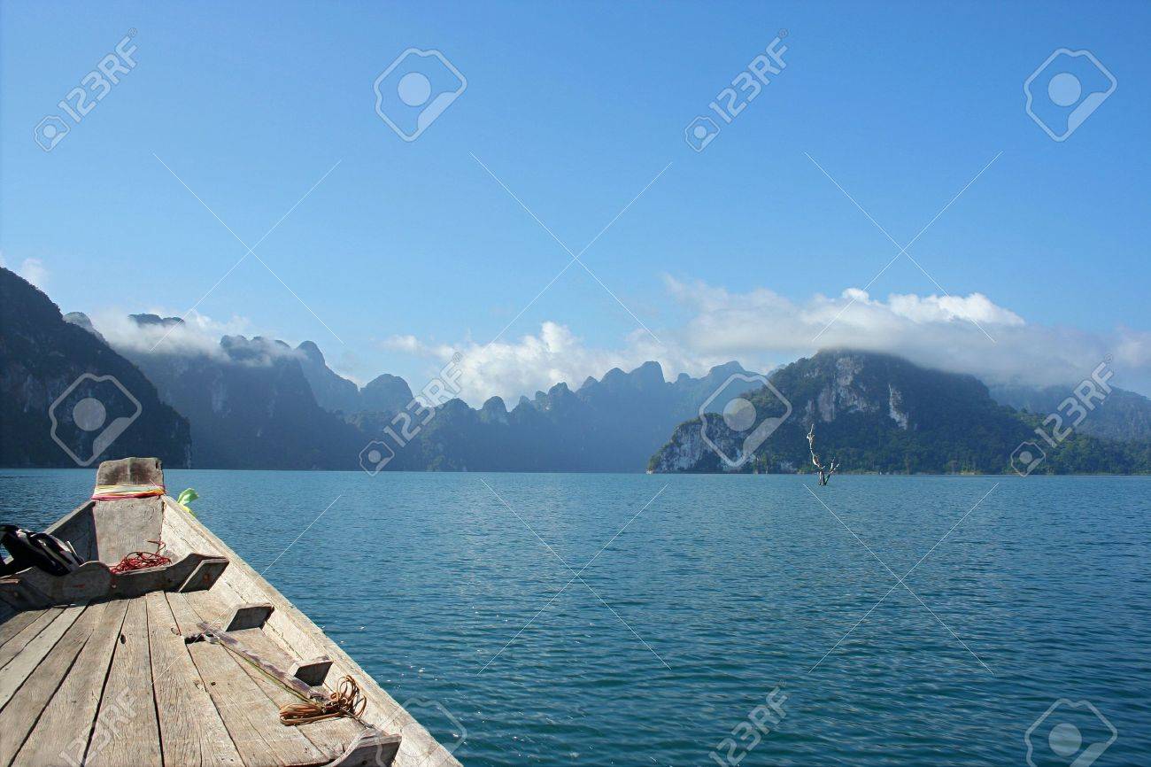 Turn the atmosphere within his chest Chiew Lan Dam. Surat Thani Province. When viewed from the long-tail boat while sailing away - 8055667 Turn the atmosphere within his chest Chiew Lan Dam. Surat Thani Province. When viewed from the long-tail boat while sailing away - 8055667