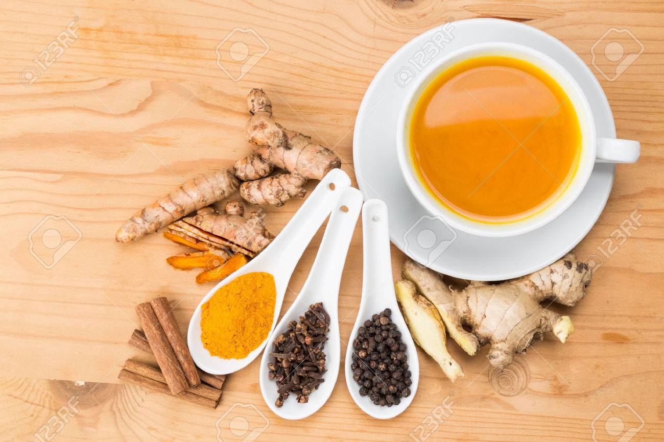 Aromatic Turmeric Tea With Black Pepper, Cinnamon, Cloves And Ginger Offers  Many Wellness Health Benefits Stock Photo, Picture and Royalty Free Image.  Image 51692184.