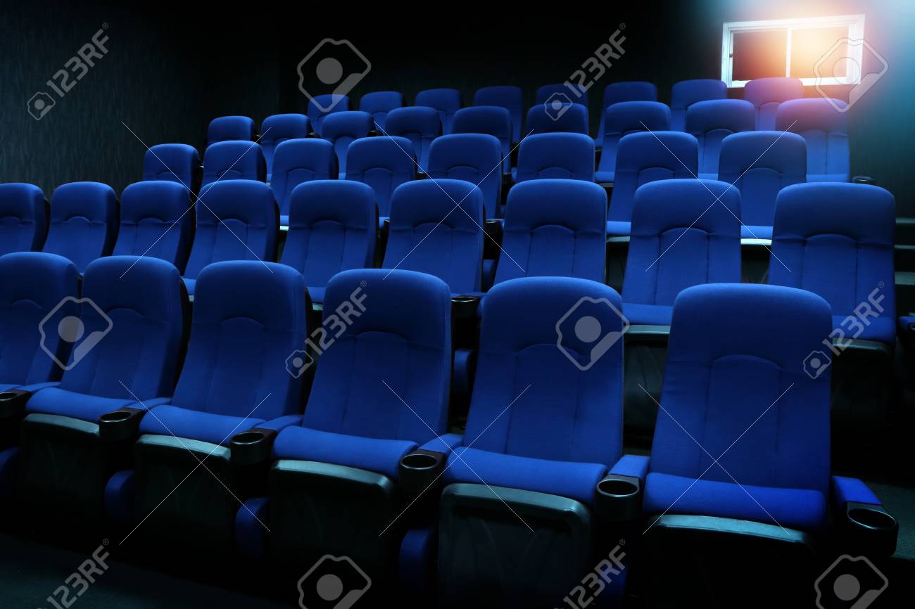 empty new blue seats in auditorium or movie theater stock photo