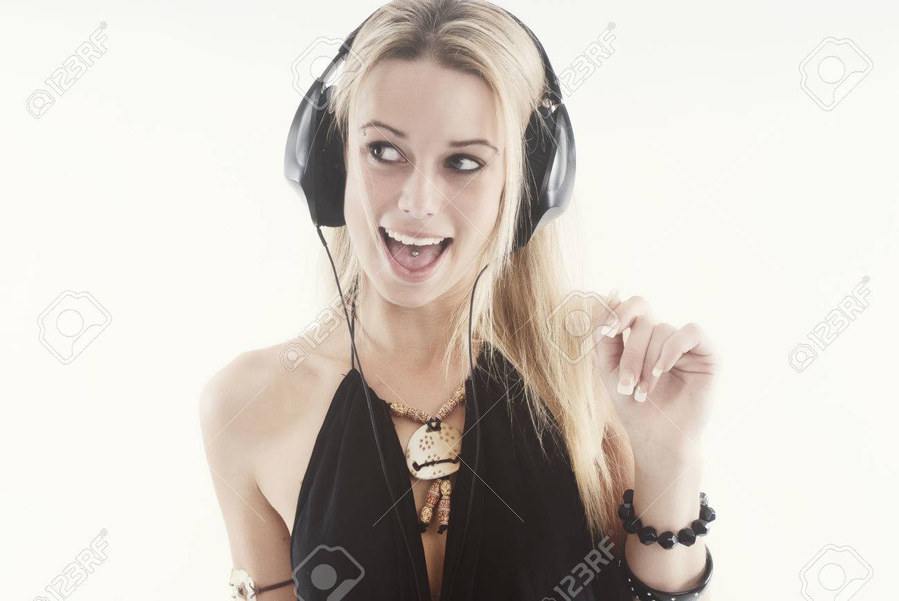 Young woman listening to music with headphones - 38081013 Young woman listening to music with headphones - 38081013
