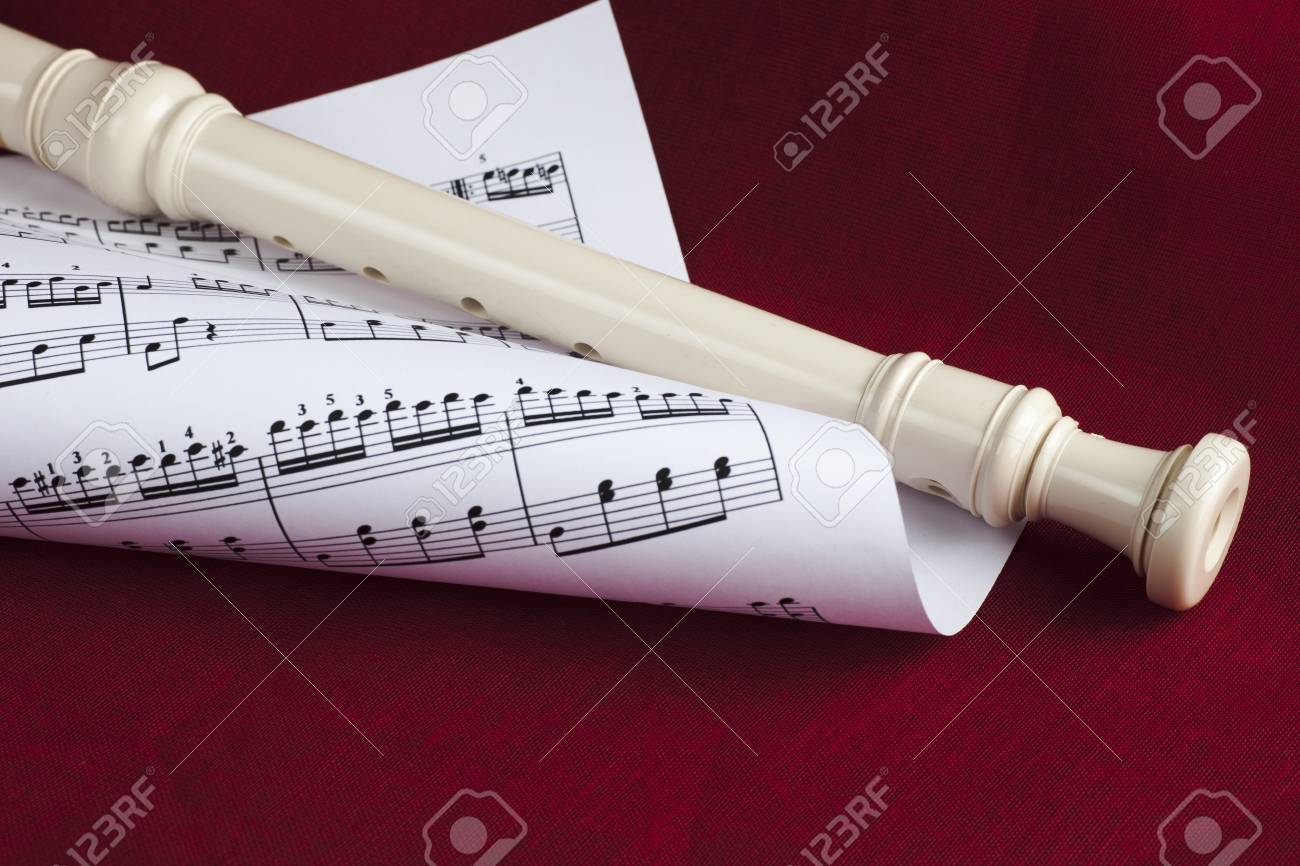 a background flute A of red is on music sheet a with combined