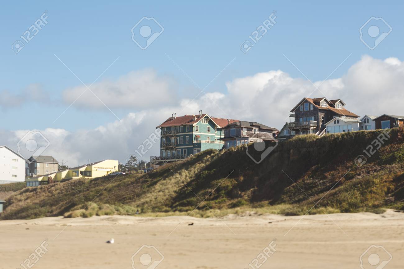 Modern Houses Sit On A Ridge On A Beach In Oregon Partly Cloudy Stock Photo