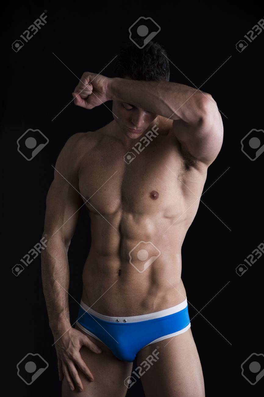 Attractive Young Man Standing With Naked Muscular Ripped Body Wiping Sweat Off Forehead Stock Photo Attractive Young Man Standing With Naked Muscular Ripped Body Wiping Sweat Off Forehead Stock Photo