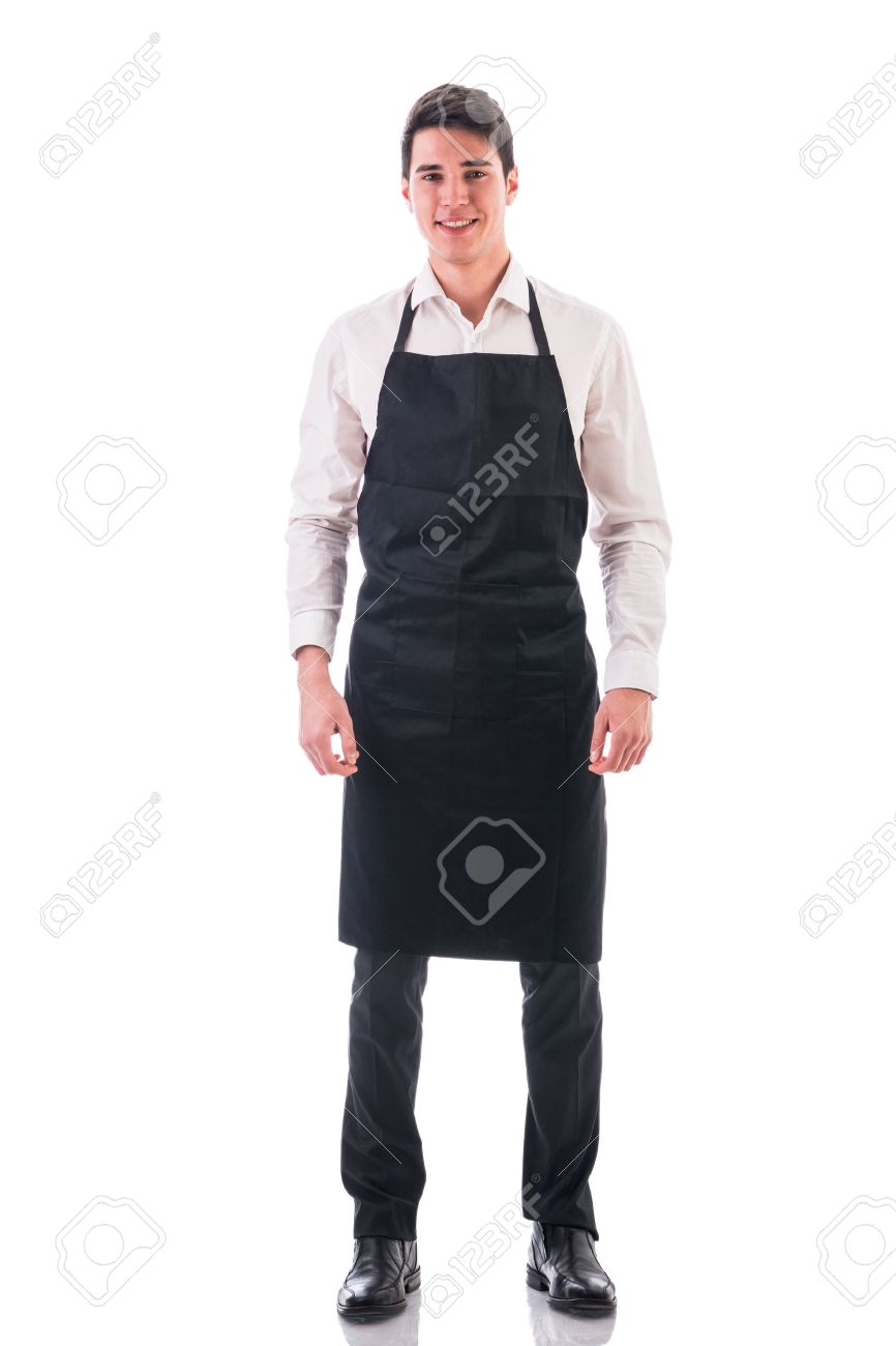 若いシェフやウェイター ポーズの全身ショット ブラック エプロン 白いワイシャツを身に着けている白い背景に分離されました の写真素材 画像素材 Image