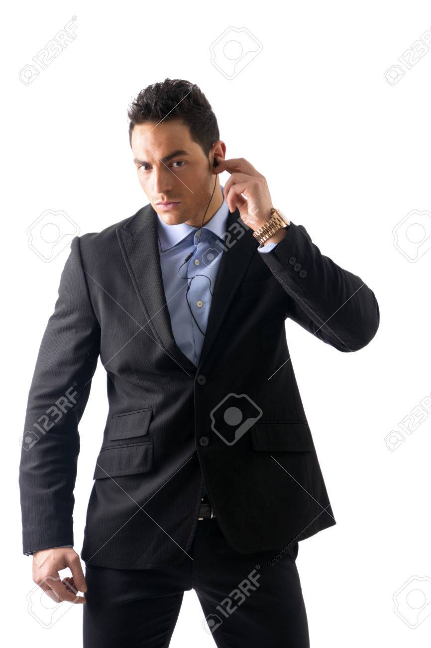 elegant man ressed as bodyguard or security agent with earphones security agent