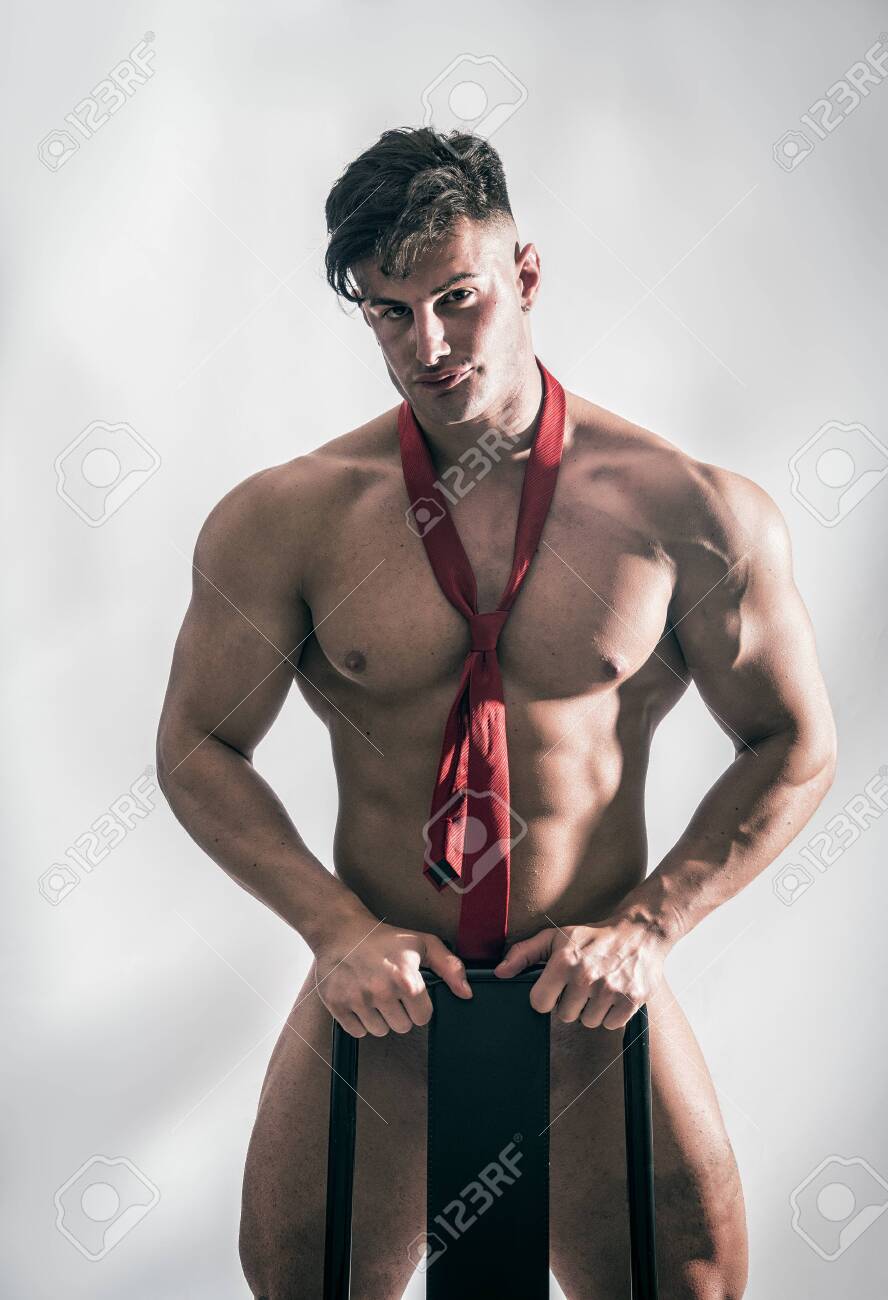 122129436-muscular-bodybuilder-standing-