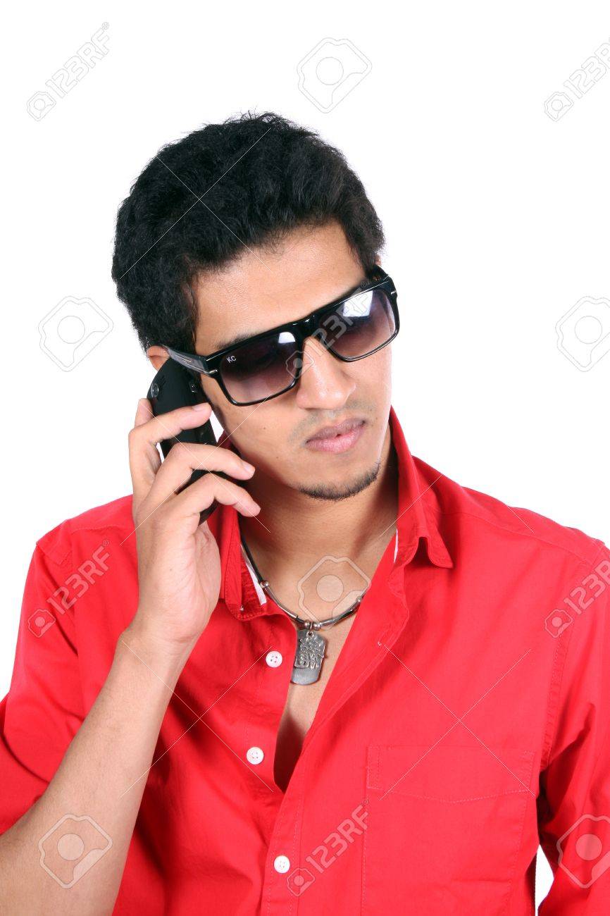 A Young Indian Guy Talking On The Mobile Phone Cellphone On White Studio Background Stock Photo Picture And Royalty Free Image Image 11793983