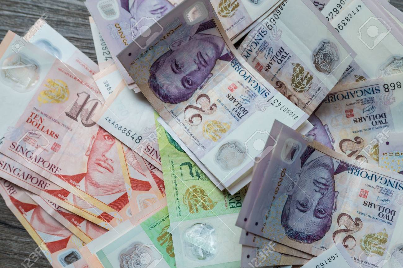 Singapore Dollar SGD Banknote On Wood Background Stock Photo, Picture and  Royalty Free Image. Image 59822710.