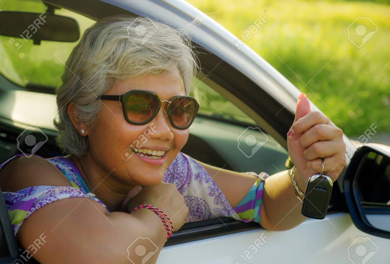 Lifestyle Portrait Of Attractive And Happy Middle Aged Asian