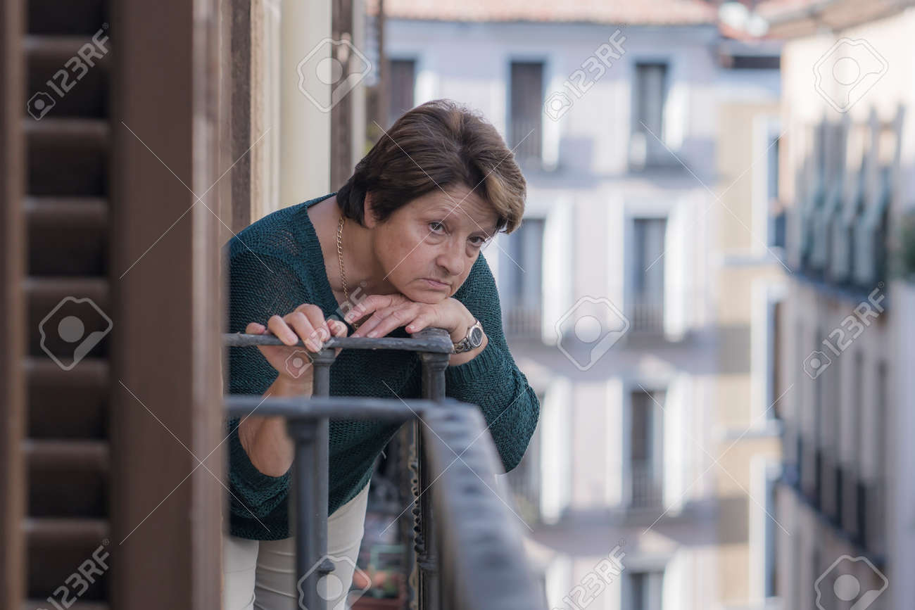dramatic lifestyle portrait of mature woman on her 70s depressed and sad at home balcony feeling desperate suffering anxiety problem in senior female depression concept - 158052389 dramatic lifestyle portrait of mature woman on her 70s depressed and sad at home balcony feeling desperate suffering anxiety problem in senior female depression concept - 158052389