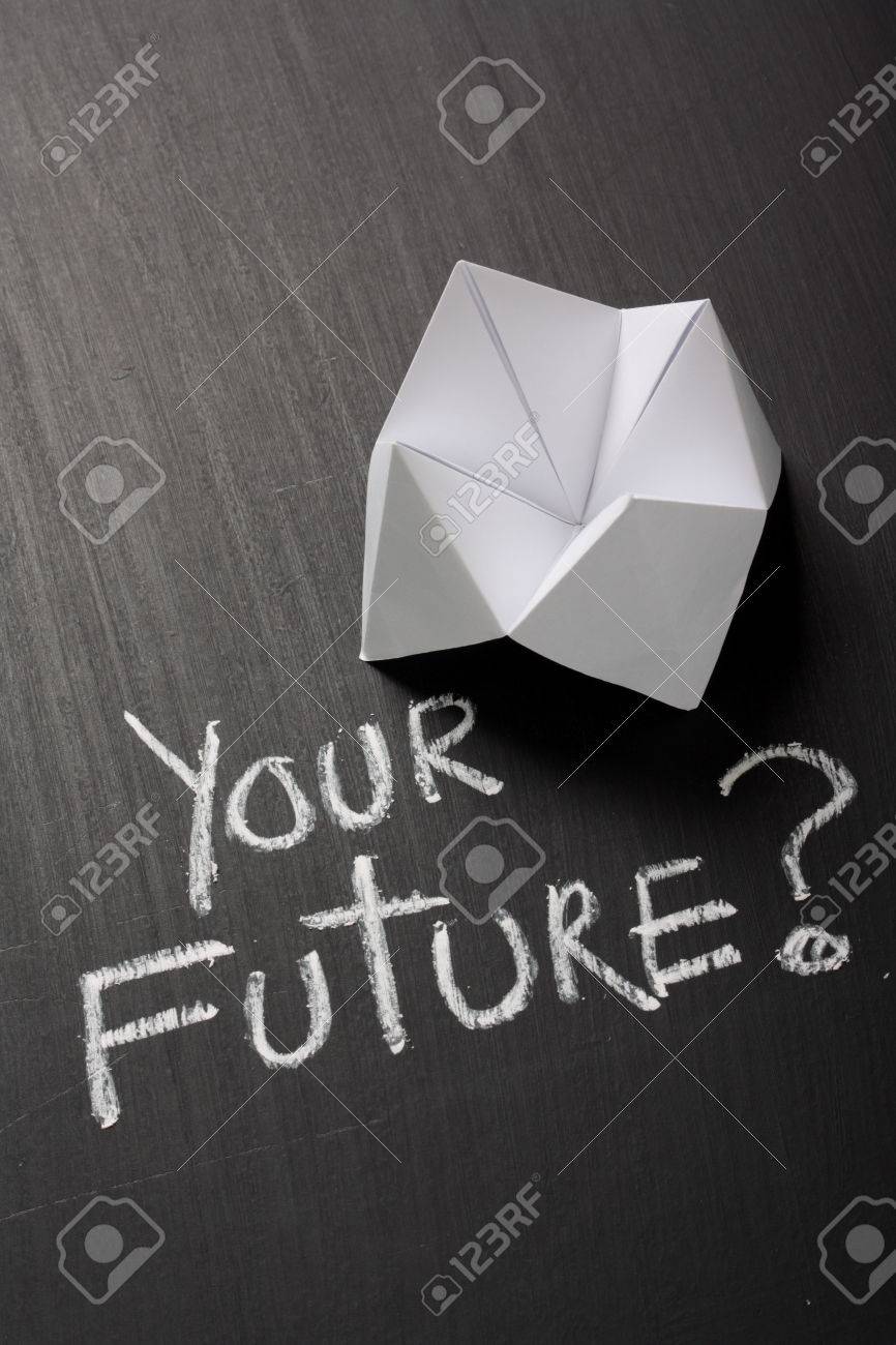Origami Fortune Teller Made From White Paper On A Blackboard