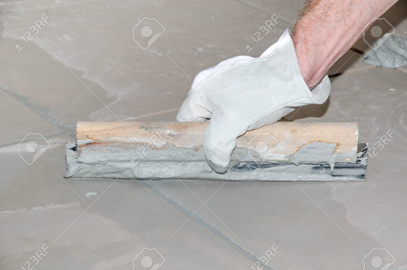 Laying Floor Tiles Tiler Filling Up Joints Between Ceramic Tiles