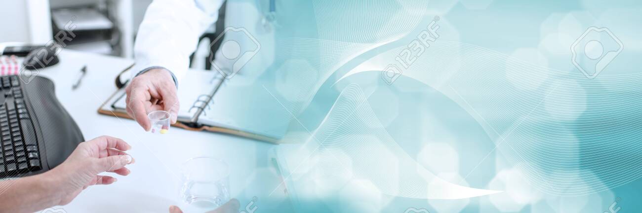 Doctor giving pills to his patient in his office; panoramic banner - 143602963 Doctor giving pills to his patient in his office; panoramic banner - 143602963