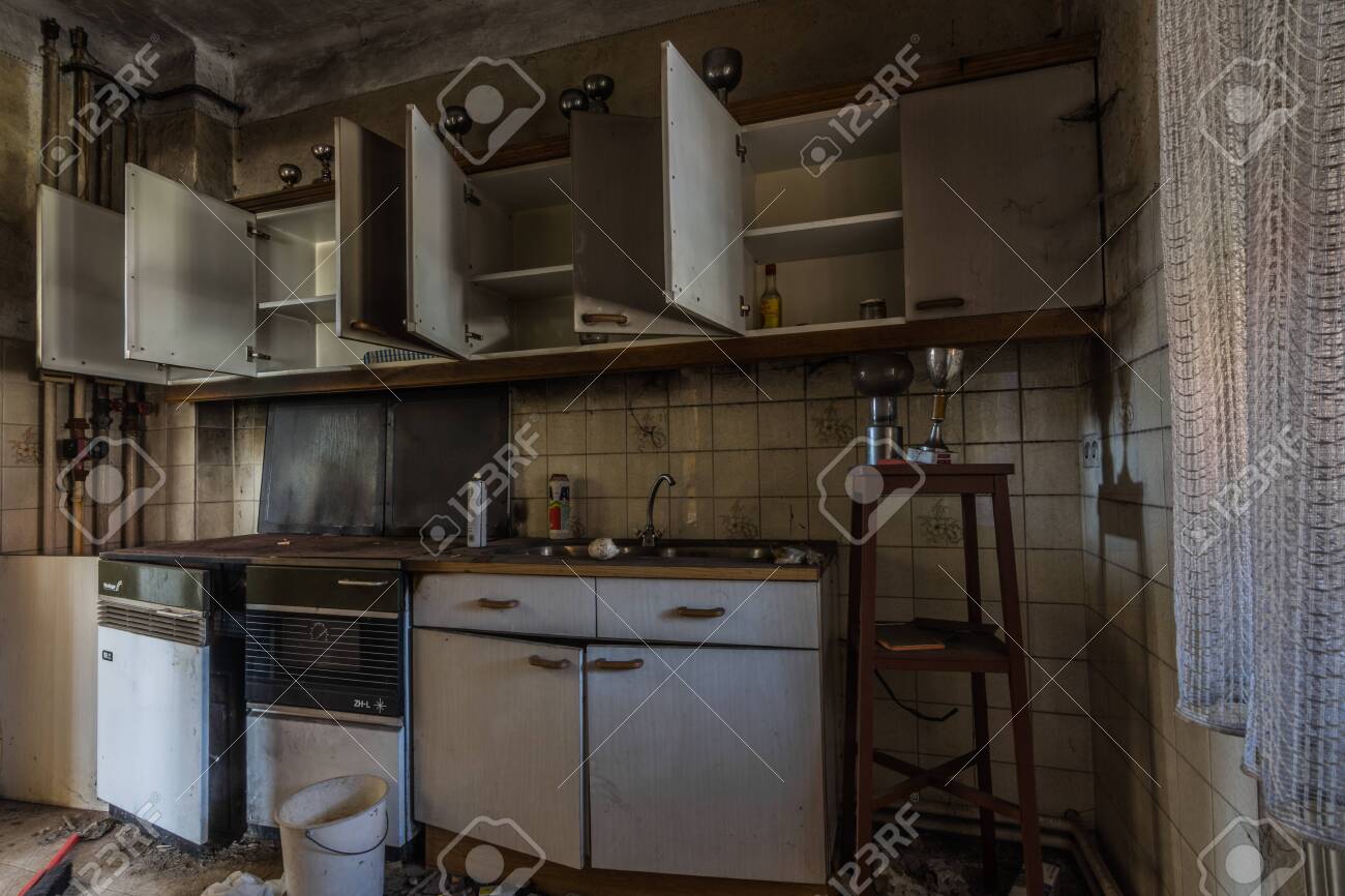 Kitchen With Cups In An Old Abandoned House Stock Photo, Picture and  Royalty Free Image. Image 139022844., image size:1300x866