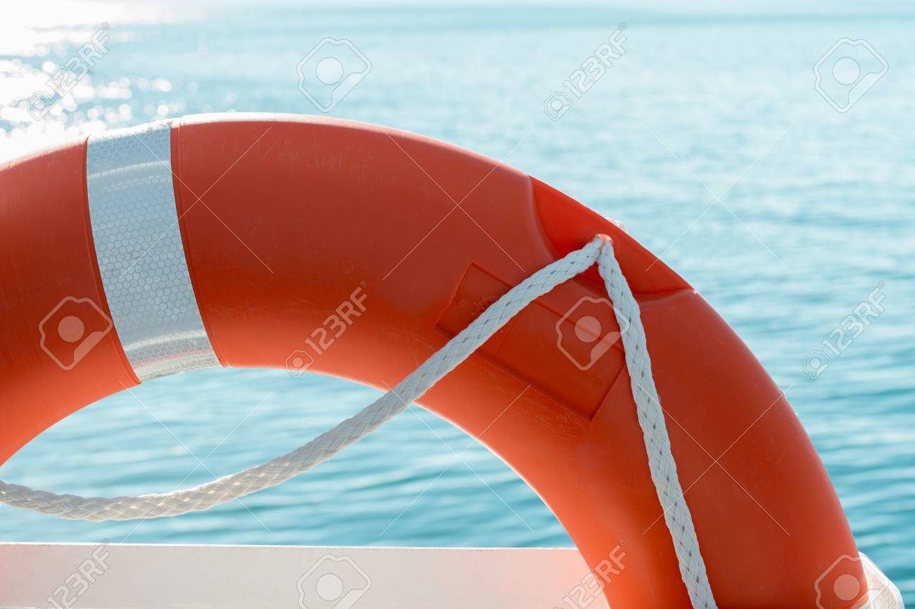 red lifesaver on a boat and sea background stock photo picture and