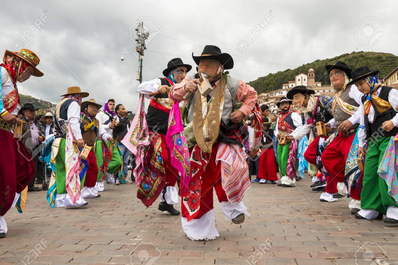 Cuzco, Peru - December 25, 2013: Man waering traditional clothes and masks dancing the Huaylia in the Christmas day in front of the Cuzco Cathedral in Cuzco, Peru. - 74196571 Cuzco, Peru - December 25, 2013: Man waering traditional clothes and masks dancing the Huaylia in the Christmas day in front of the Cuzco Cathedral in Cuzco, Peru. - 74196571