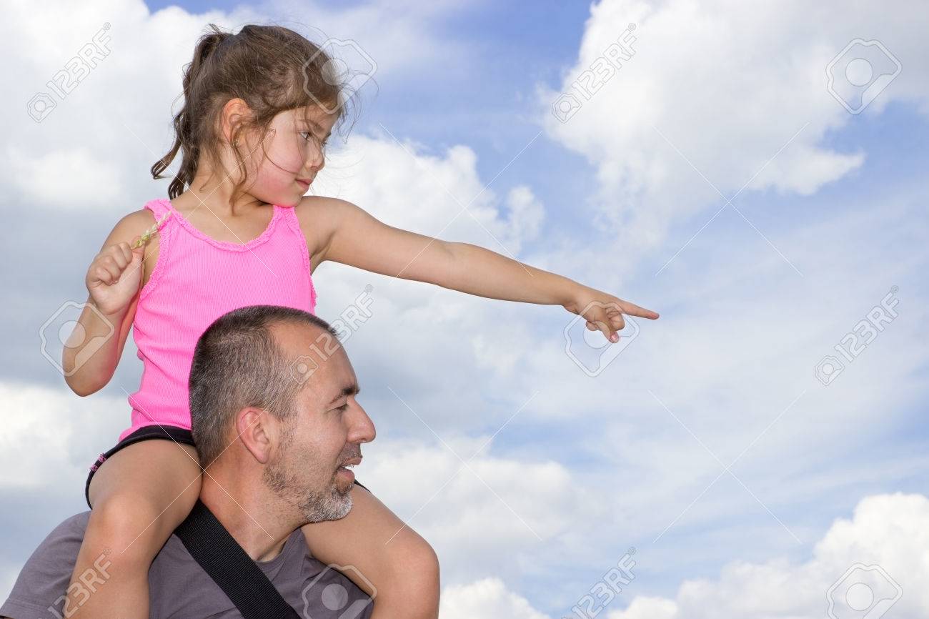 Child Sitting On The Shoulders Of A Man Pointing In One Direction Stock Photo Picture And Royalty Free Image Image 36566846