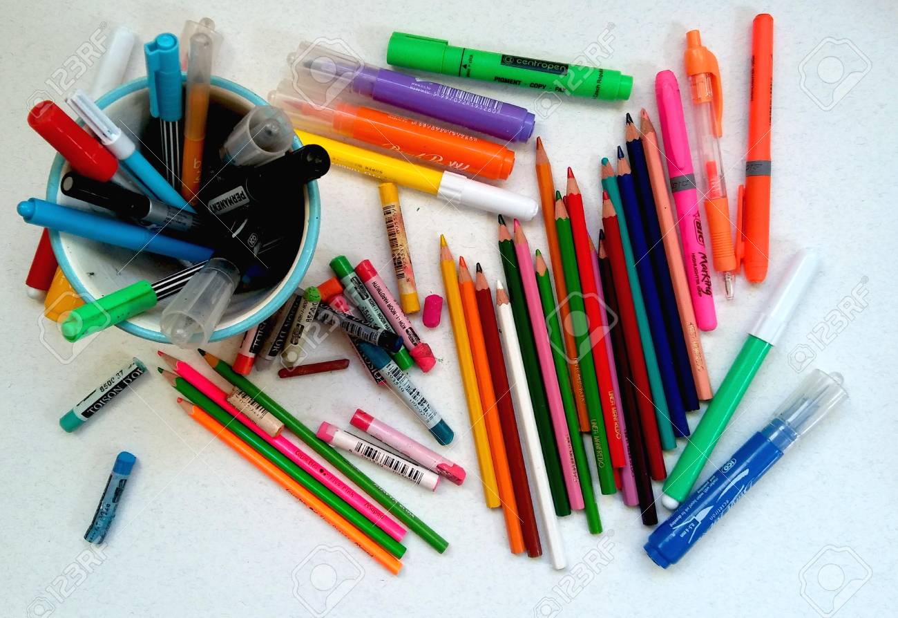 color mess scattered crayons pastels and markers stock photo