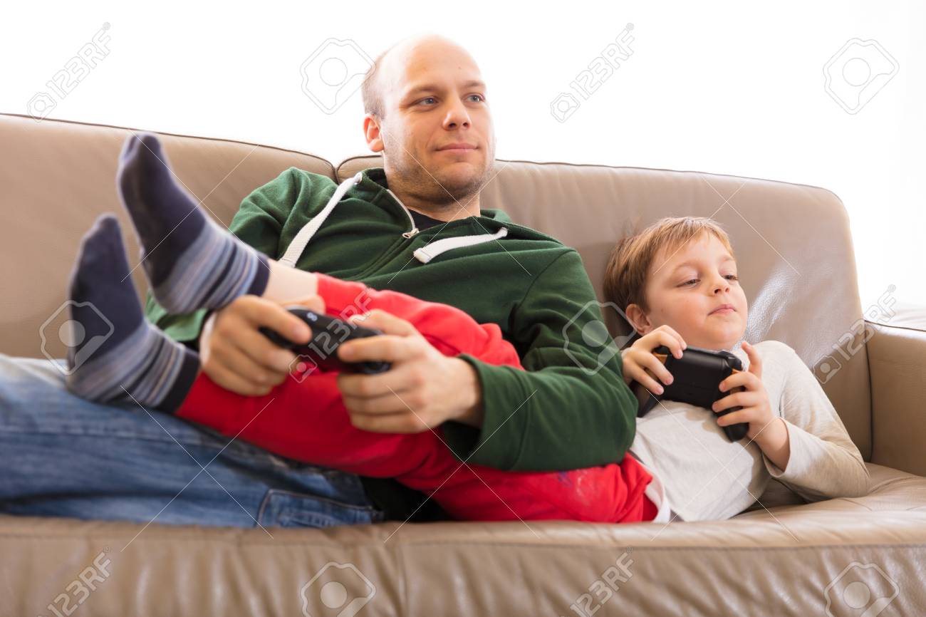 father and son playing video games