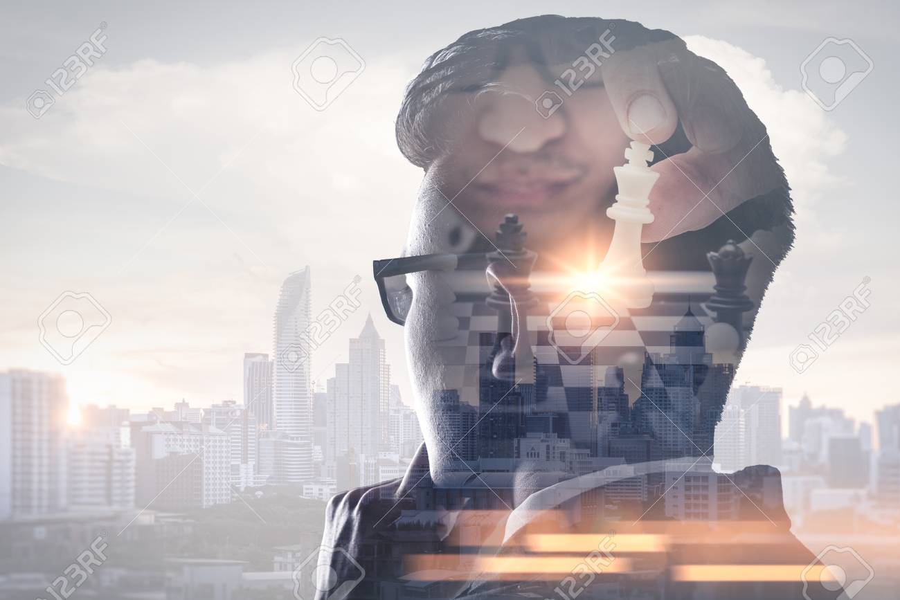 The double exposure image of the businessman thinking overlay with chess game and cityscape image. the concept of strategic, planning, management, intelligence and education. - 108368771 The double exposure image of the businessman thinking overlay with chess game and cityscape image. the concept of strategic, planning, management, intelligence and education. - 108368771
