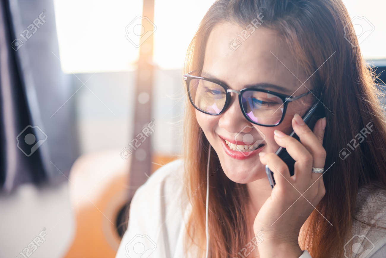 the abstract image of the businesswoman is quarantining herself and calling to another one via a smartphone at her home. the concept of covit-19, work at home, quarantine, healthcare and business. - 155501567 the abstract image of the businesswoman is quarantining herself and calling to another one via a smartphone at her home. the concept of covit-19, work at home, quarantine, healthcare and business. - 155501567