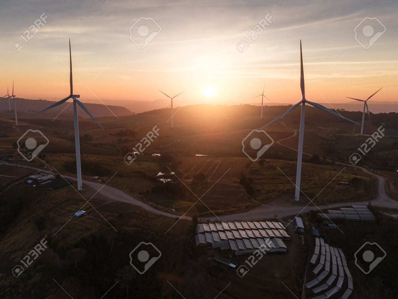 the wind turbines field and the sunrise. the concept of clean energy, environment, electricity and Industrial - 161907843 the wind turbines field and the sunrise. the concept of clean energy, environment, electricity and Industrial - 161907843